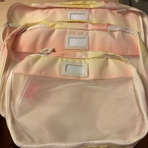 Calpak packing cubes - mesh top and zipper closes